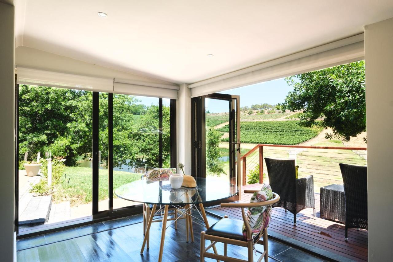 Alluvia Boutique Winery & Luxury Accommodation Стеленбош Екстериор снимка A room with a view of the vineyards