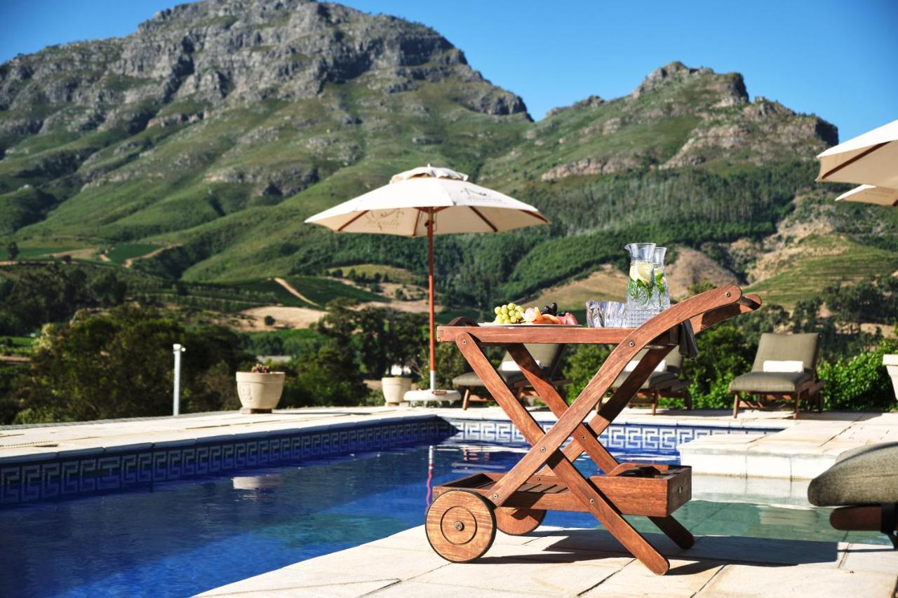 Alluvia Boutique Winery & Luxury Accommodation Стеленбош Екстериор снимка A poolside bar cart
